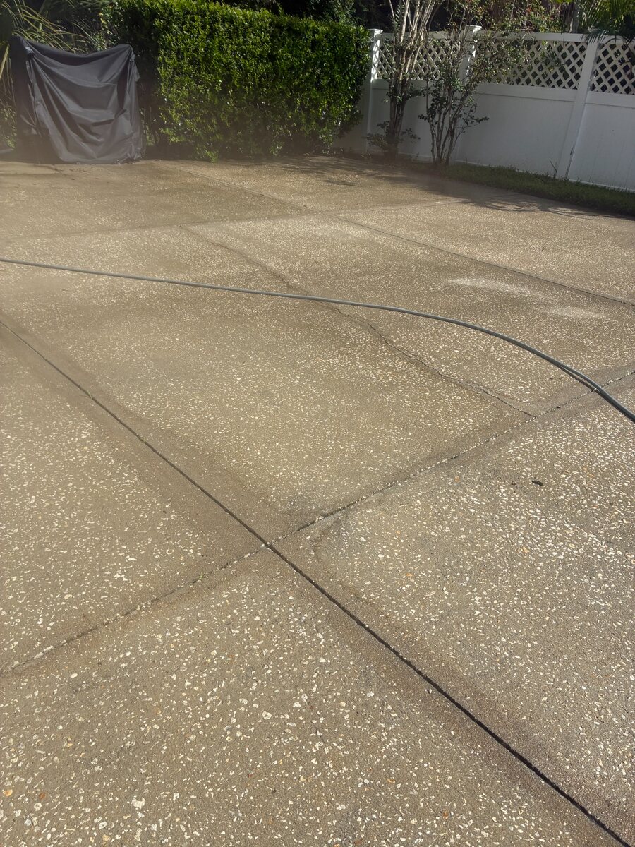 Patio concrete during pressure washing in Kissimmee Florida