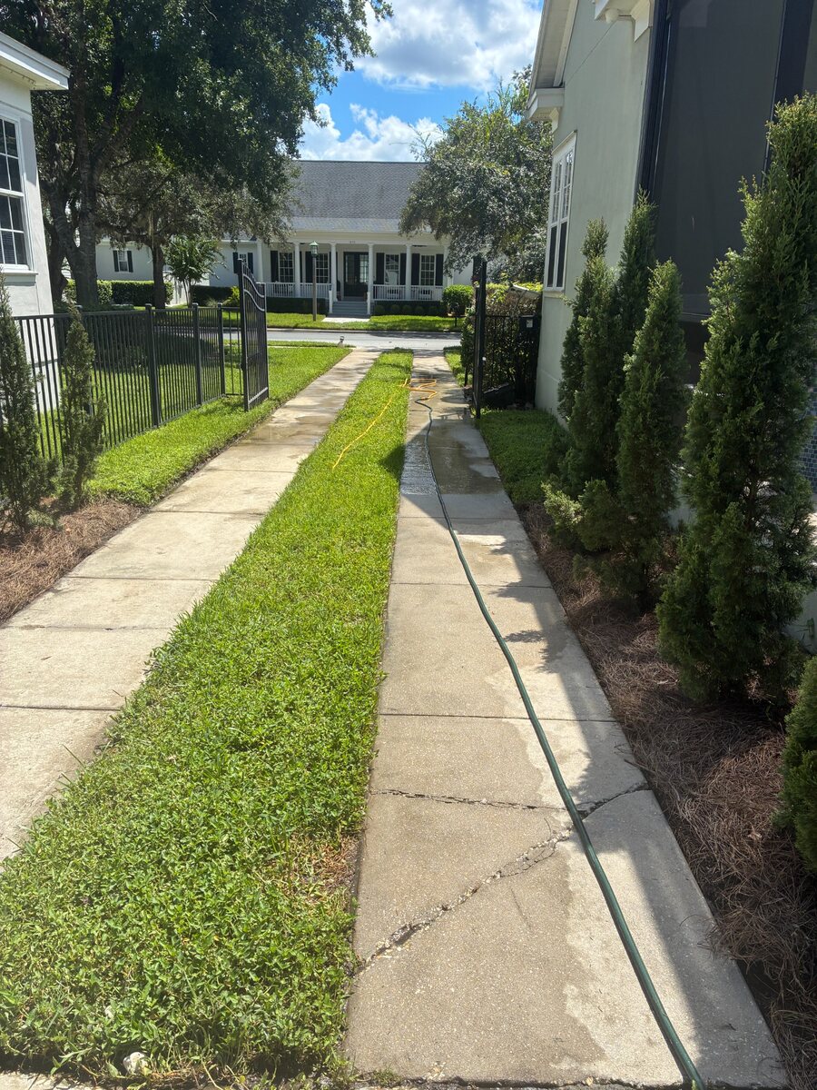 Residential sidewalk being pressure washed in Kissimmee Florida