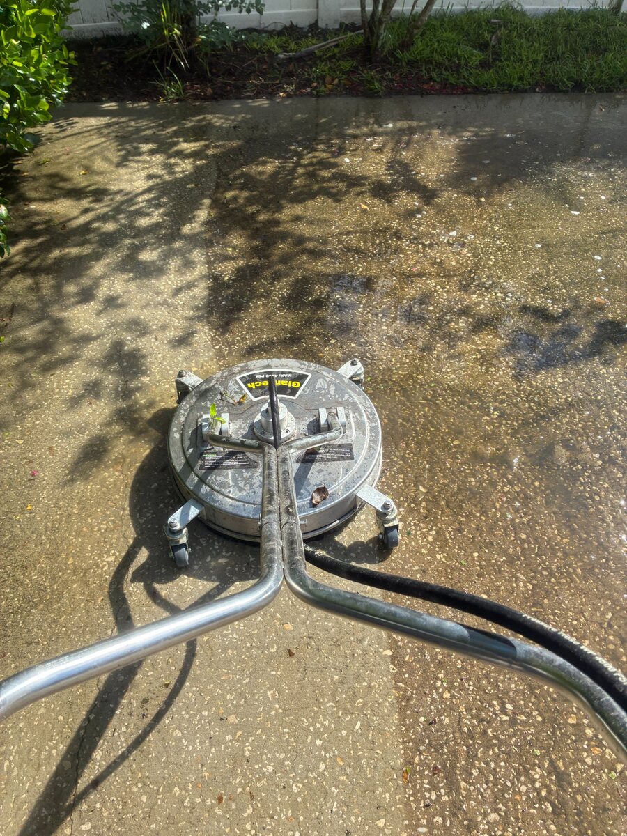 Surface cleaner removing buildup from concrete in Kissimmee Florida
